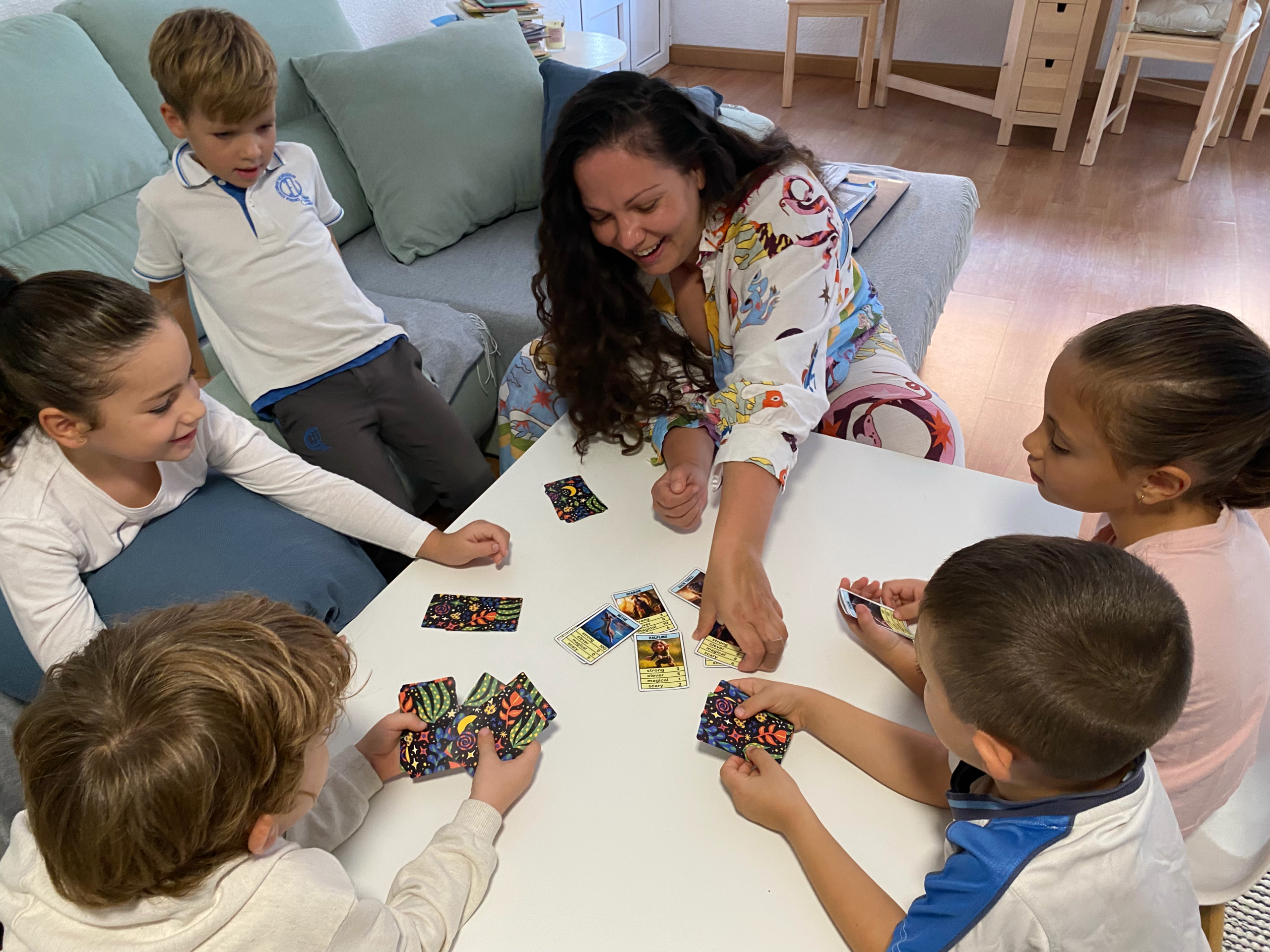 Yana teaching English with a card game